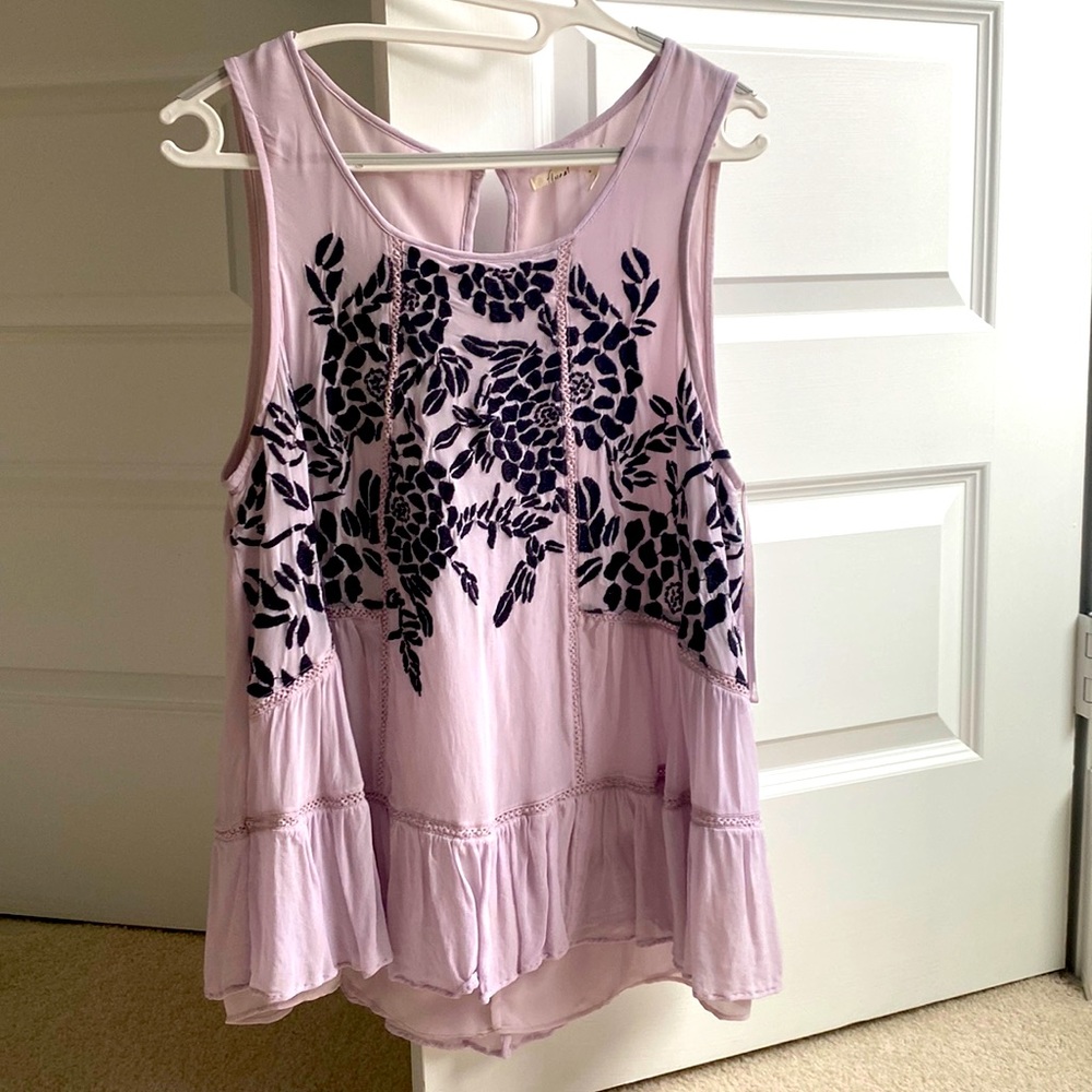Airy purple top with embroidered dark purple flowers. Stylish summer look.